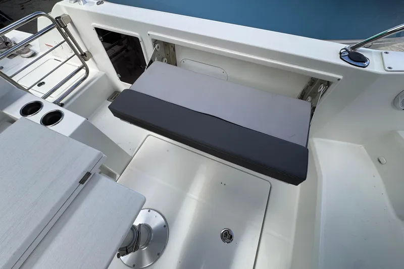  Yacht Photos Pics 2021 Jeanneau Leader 9.0 WA boat interior with seating and cup holders.