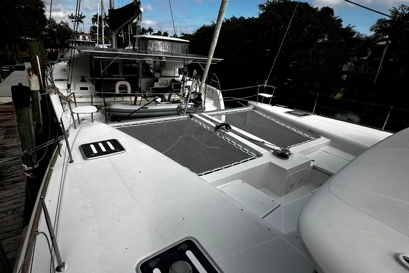 Cruisin Cajun Yacht Photos Pics 2017 Lagoon 450 F catamaran docked, showcasing spacious deck and sleek design.