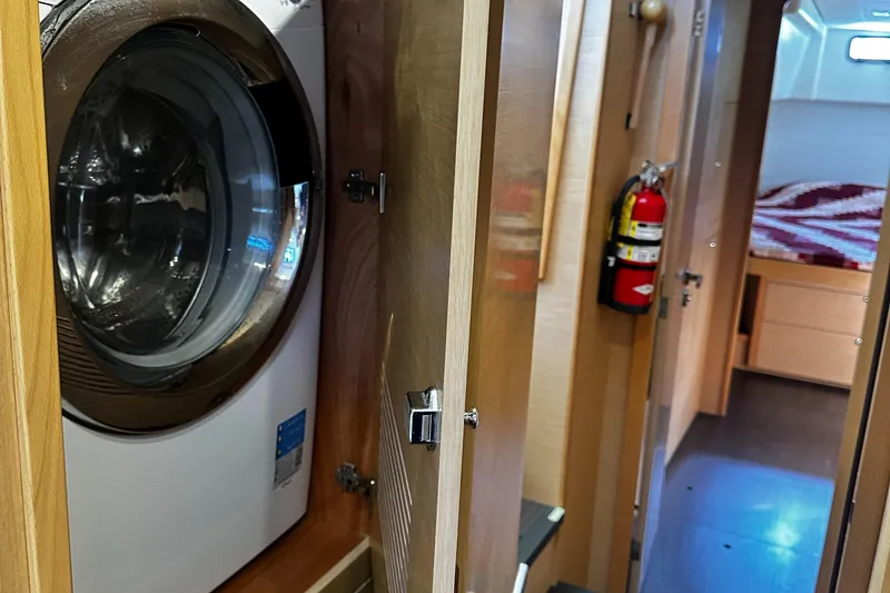 Cruisin Cajun Yacht Photos Pics Interior of 2017 Lagoon 450 F yacht with washing machine and cabin view.