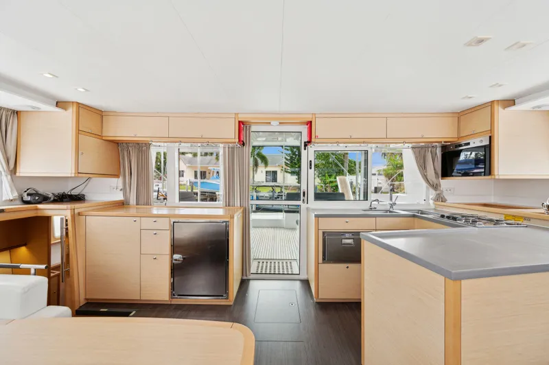 Cruisin Cajun Yacht Photos Pics Interior of 2017 Lagoon 450 F catamaran with modern kitchen and ample natural light.