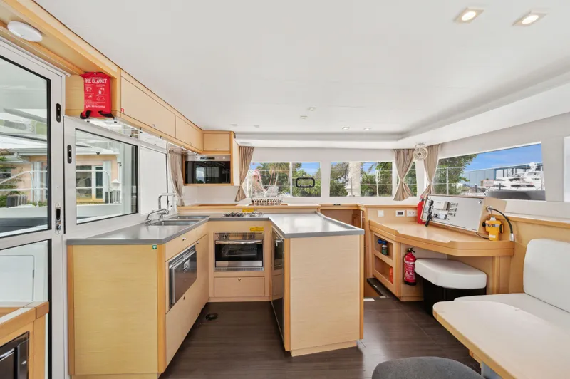 Cruisin Cajun Yacht Photos Pics Spacious interior of 2017 Lagoon 450 F catamaran with modern kitchen and seating area.