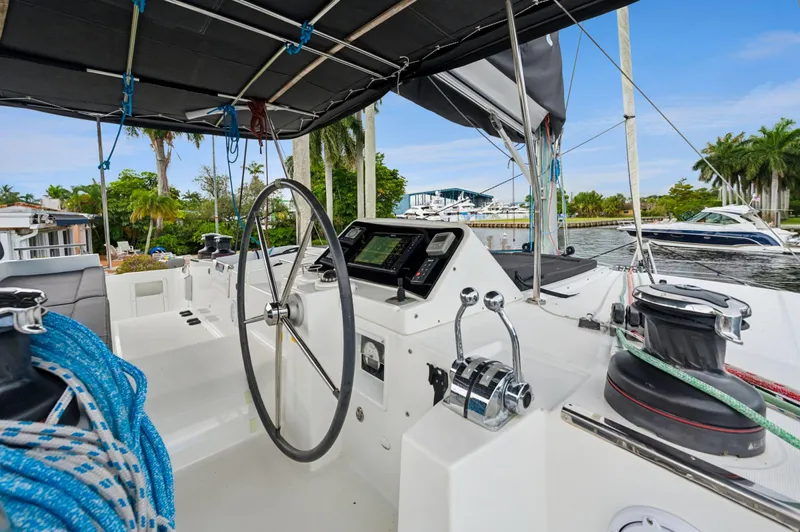Cruisin Cajun Yacht Photos Pics Helm of 2017 Lagoon 450 F catamaran with steering wheel and navigation controls.