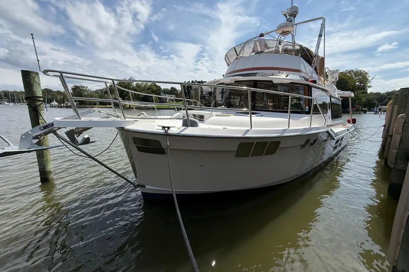  Yacht Photos Pics 2021 Ranger Tugs R-41CB yacht docked on a sunny day, showcasing sleek design.