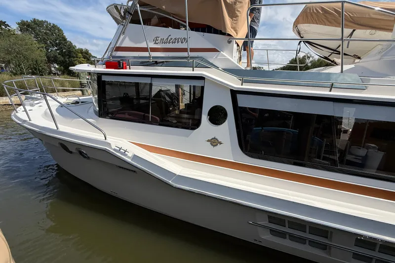  Yacht Photos Pics 2021 Ranger Tugs R-41CB boat docked, featuring sleek design and spacious deck.
