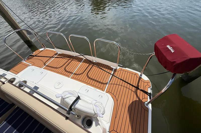  Yacht Photos Pics 2021 Ranger Tugs R-41CB boat deck with teak flooring and Magma grill cover.