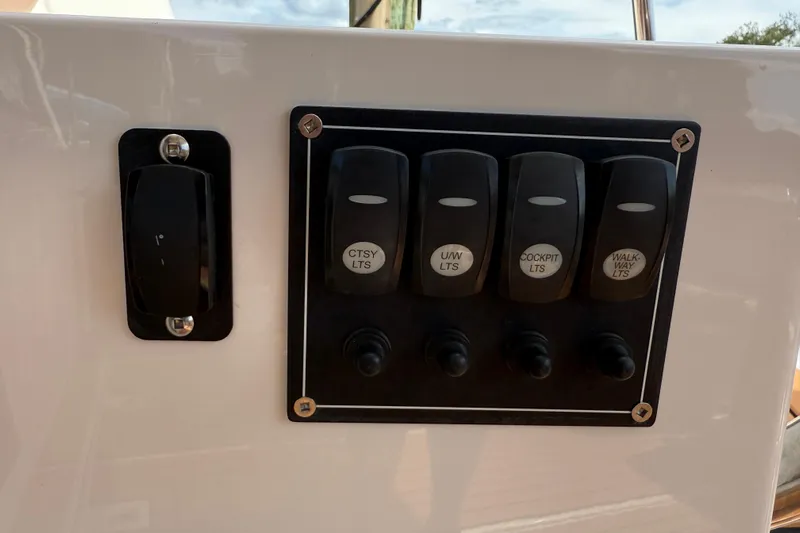  Yacht Photos Pics Control panel of 2021 Ranger Tugs R-41CB with labeled light switches.