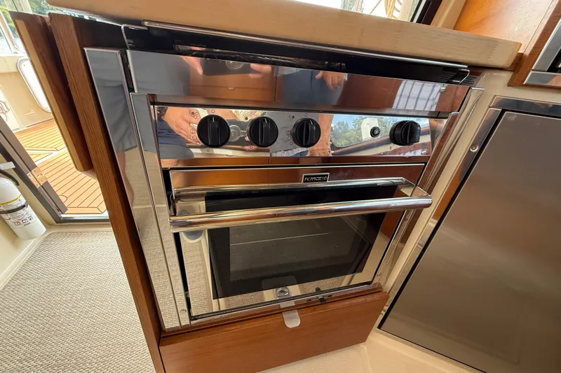  Yacht Photos Pics Stainless steel oven in 2021 Ranger Tugs R-41CB boat kitchen interior.
