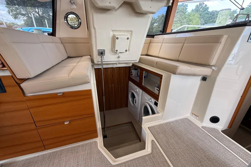  Yacht Photos Pics Interior of 2021 Ranger Tugs R-41CB with seating and laundry area.