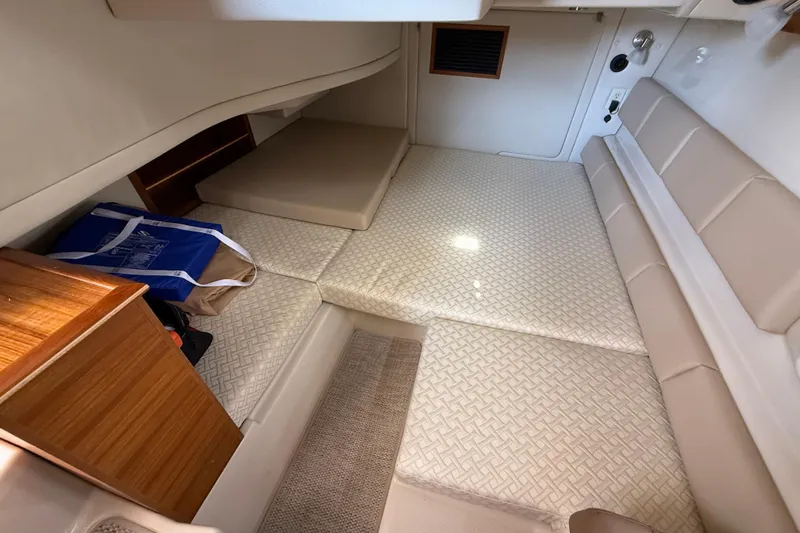  Yacht Photos Pics 2021 Ranger Tugs R-41CB cabin interior with beige seating and storage.