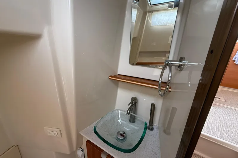  Yacht Photos Pics 2021 Ranger Tugs R-41CB bathroom with modern sink and mirror.
