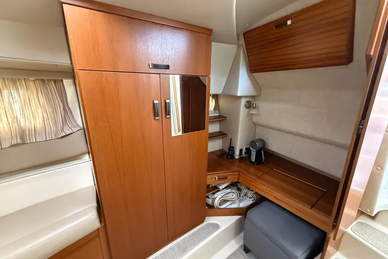  Yacht Photos Pics 2021 Ranger Tugs R-41CB cabin interior with wooden cabinetry and seating area.