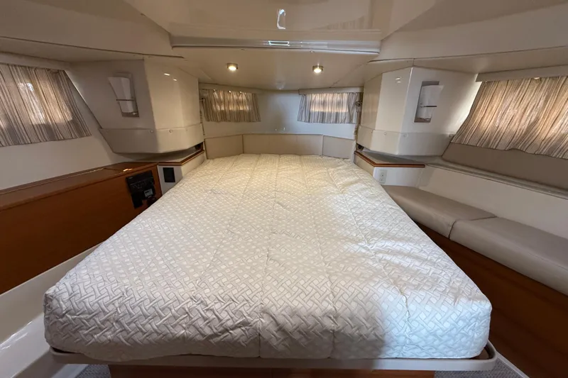  Yacht Photos Pics Luxurious cabin interior of 2021 Ranger Tugs R-41CB with spacious bed and elegant decor.