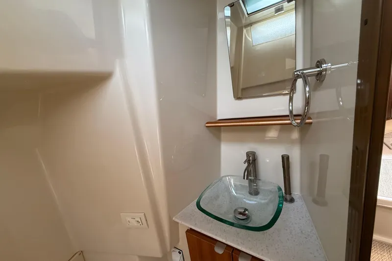  Yacht Photos Pics 2021 Ranger Tugs R-41CB bathroom with modern glass sink and mirror.