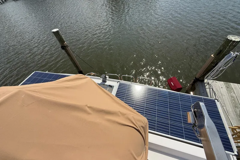  Yacht Photos Pics 2021 Ranger Tugs R-41CB with solar panels docked by the water.
