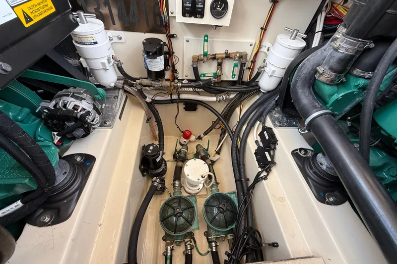  Yacht Photos Pics Engine compartment of 2021 Ranger Tugs R-41CB, showcasing mechanical components and wiring.