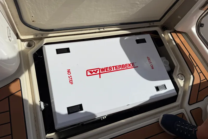  Yacht Photos Pics Westerbeke generator in 2021 Ranger Tugs R-41CB boat compartment, labeled "No Step."