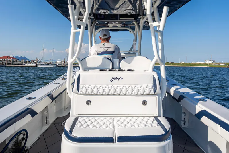  Yacht Photos Pics 2021 Yellowfin 32 Offshore boat on water, featuring luxurious seating and sleek design.