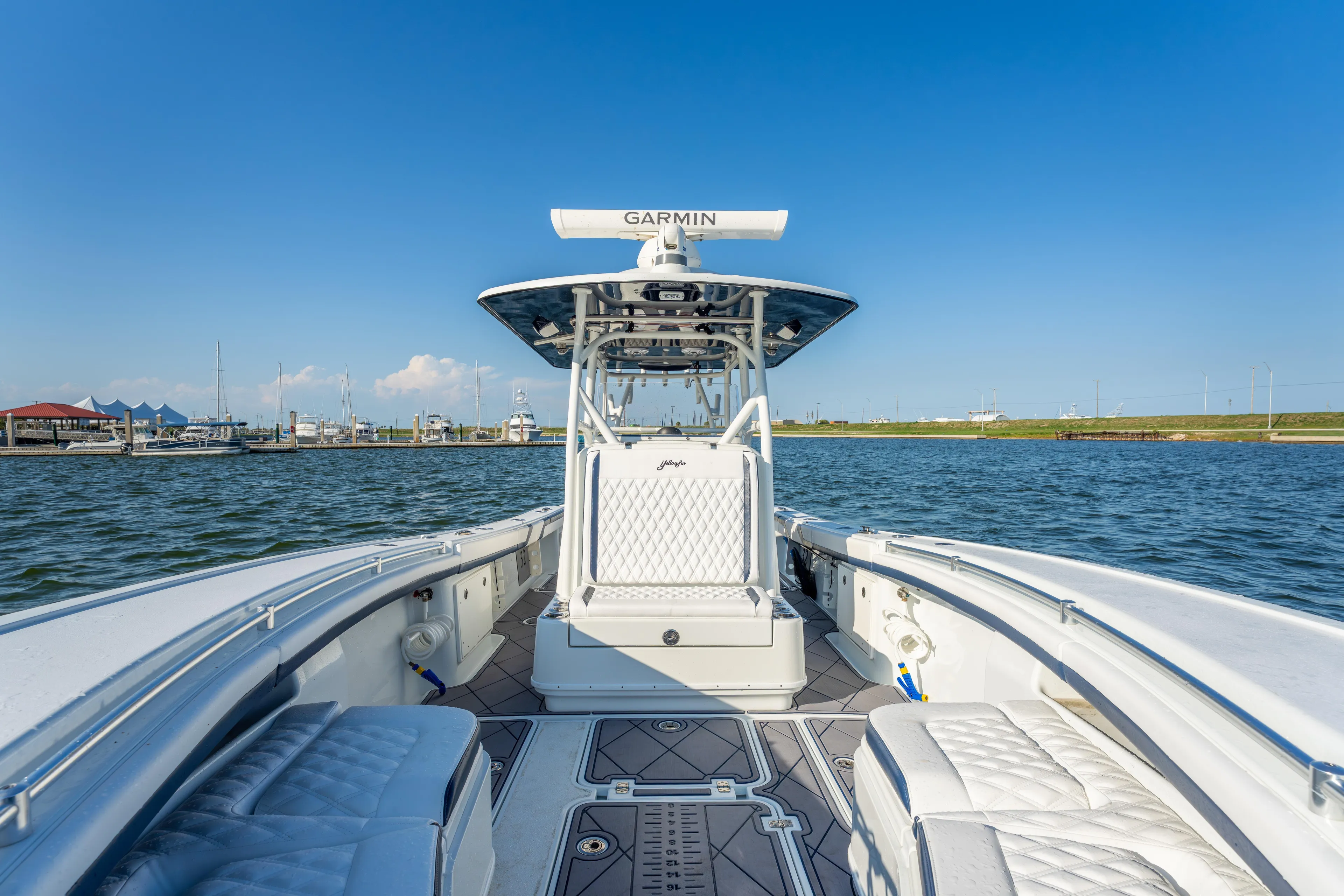  Yacht Photos Pics 2021 Yellowfin 32 Offshore boat on water, featuring sleek design and advanced navigation equipment.