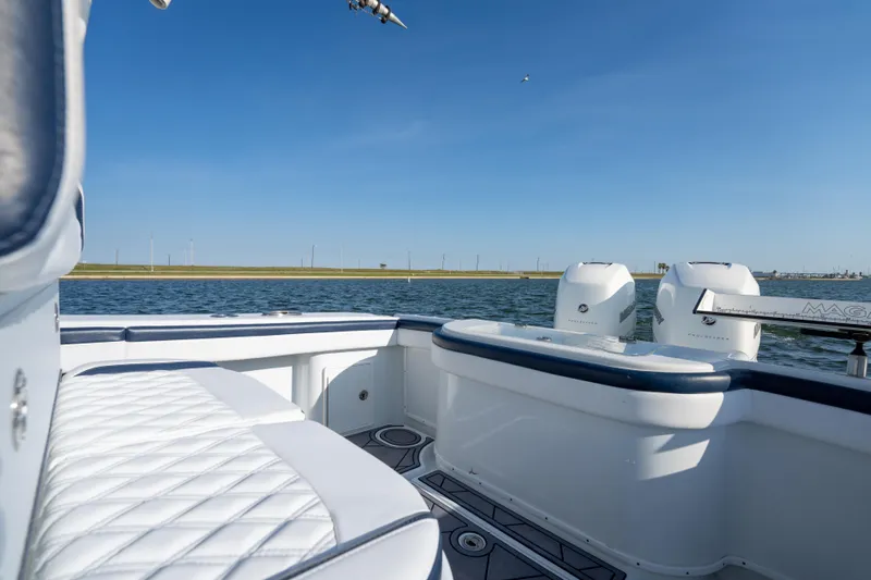  Yacht Photos Pics 2021 Yellowfin 32 Offshore boat with twin engines on calm water.