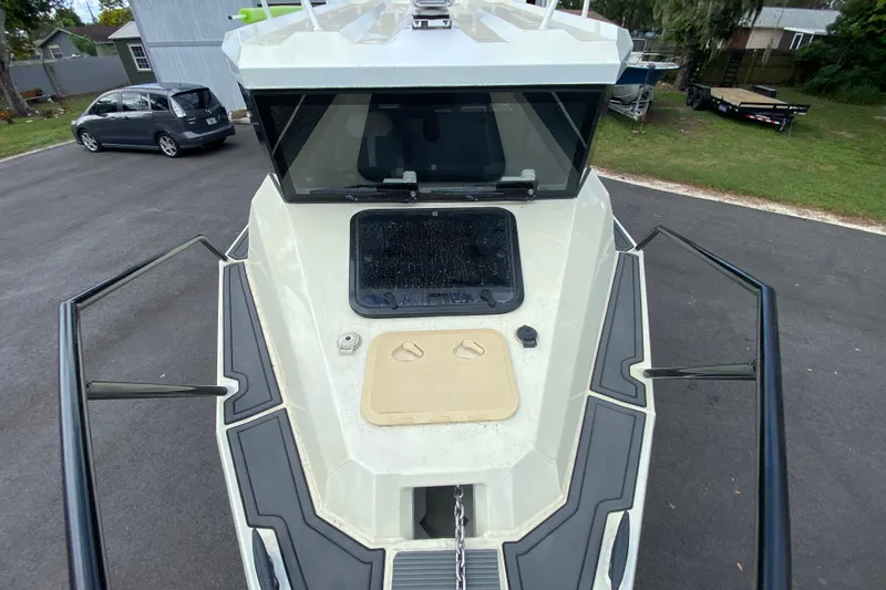  Yacht Photos Pics 2024 Sea King 260 boat on trailer, showing front deck and windshield.