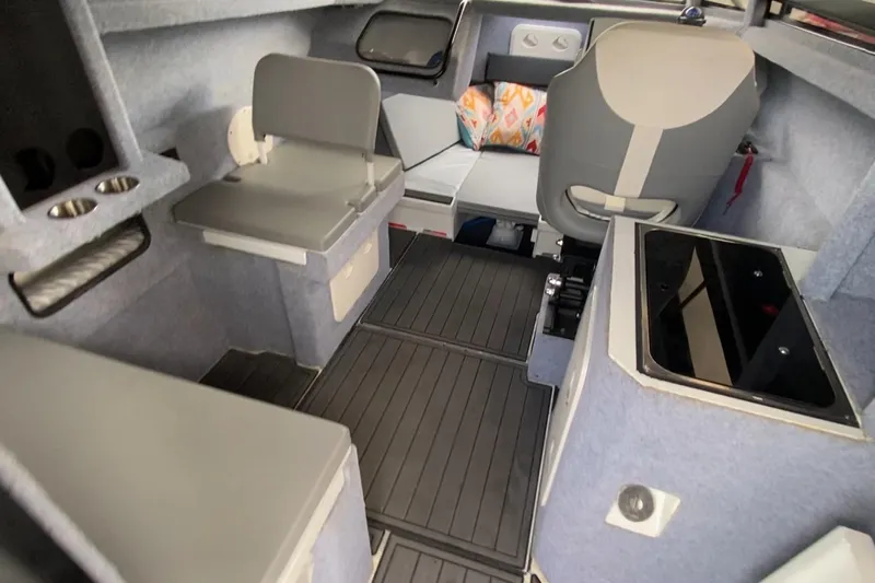  Yacht Photos Pics 2024 Sea King 260 boat interior with seating, storage, and modern design features.