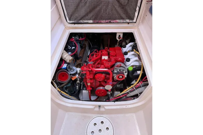  Yacht Photos Pics Engine compartment of a 1993 Jeanneau Lagoon 37 TPI Catamaran, featuring a red engine.
