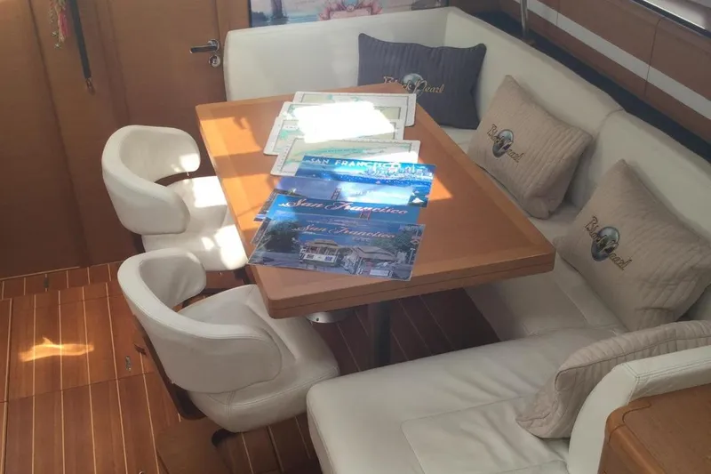 My Black Pearl Yacht Photos Pics Luxurious Jeanneau 57 yacht interior with dining area, 2015 model.