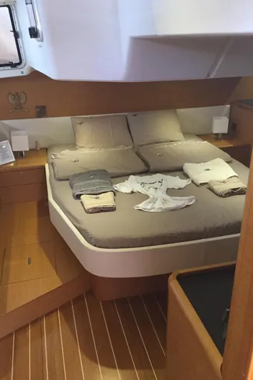 My Black Pearl Yacht Photos Pics Luxurious cabin interior of 2015 Jeanneau 57 yacht with neatly arranged linens.
