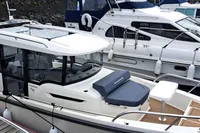 2023 Nimbus Commuter 8 boat docked, featuring sleek design and modern amenities, for sale.