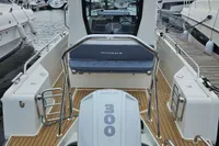 2023 Nimbus Commuter 8 boat with Mercury 300 engine at marina.
