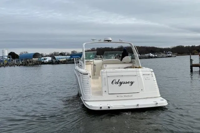  Yacht Photos Pics 2006 Rinker Fiesta Vee 410 boat named "Odyssey" on water, rear view.