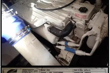  Yacht Photos Pics Engine compartment of 2006 Rinker Fiesta Vee 410 boat with visible components and labels.