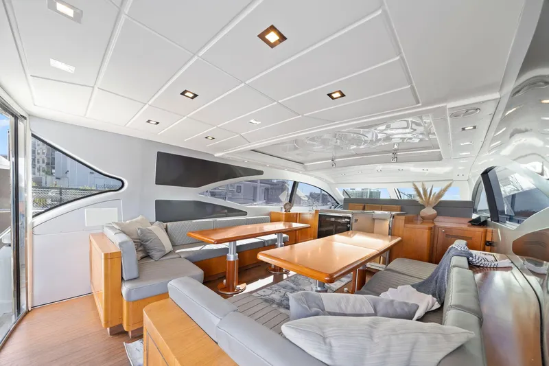 Double Down Yacht Photos Pics Luxurious interior of 2010 Mangusta 72 Express yacht with modern seating and dining area.