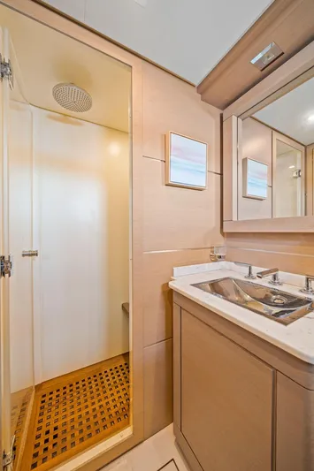 Double Down Yacht Photos Pics Luxurious bathroom in 2010 Mangusta 72 Express yacht with modern fixtures and spacious shower.