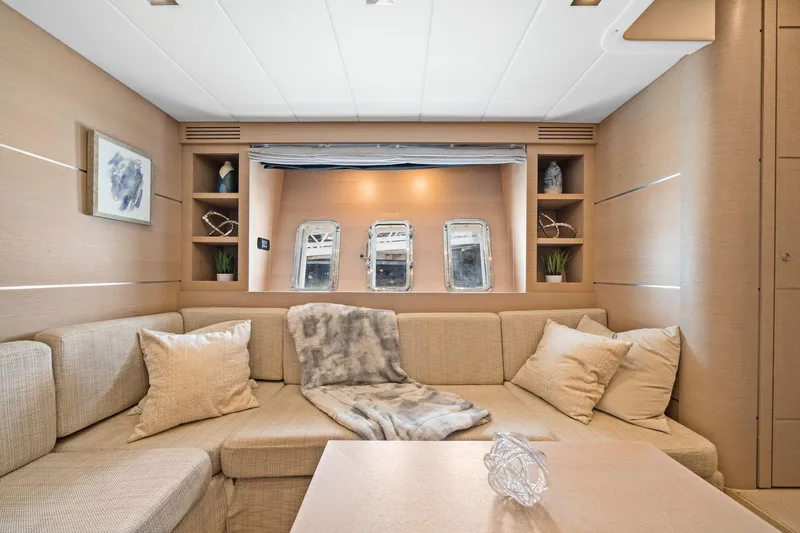 Double Down Yacht Photos Pics Luxurious interior of 2010 Mangusta 72 Express yacht with cozy seating and elegant decor.