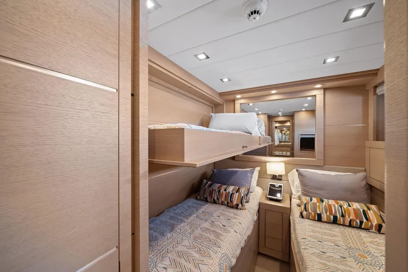 Double Down Yacht Photos Pics Luxurious cabin interior of 2010 Mangusta 72 Express yacht with modern bunk beds.