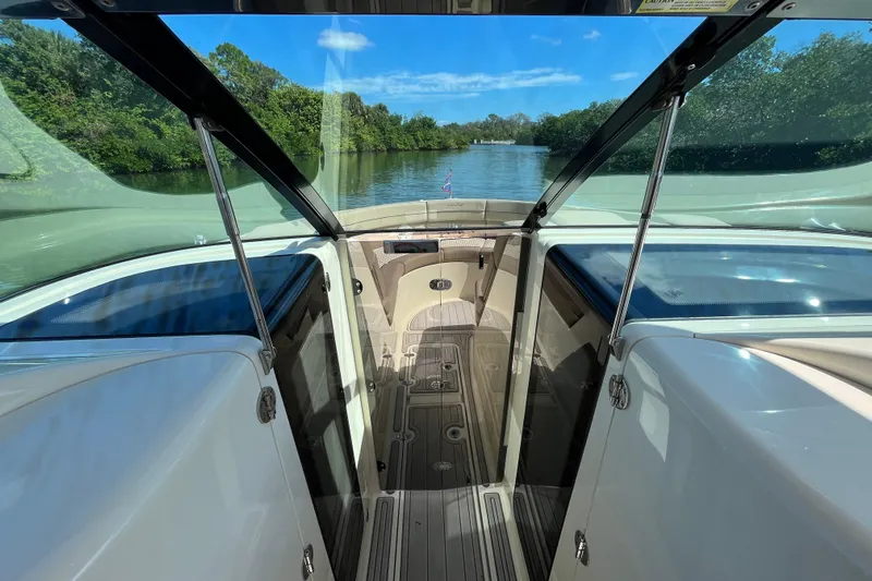  Yacht Photos Pics 2022 Chris-Craft Launch 35 GT I/O interior with scenic waterway view.