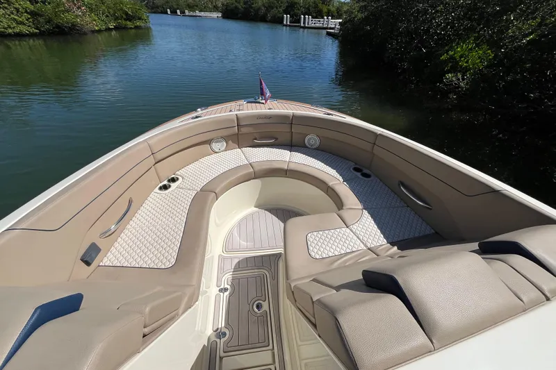  Yacht Photos Pics 2022 Chris-Craft Launch 35 GT I/O boat interior with luxurious seating on calm water.