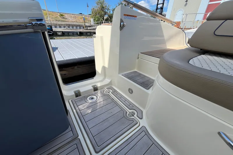  Yacht Photos Pics 2022 Chris-Craft Launch 35 GT I/O boat interior with teak flooring and cushioned seating.