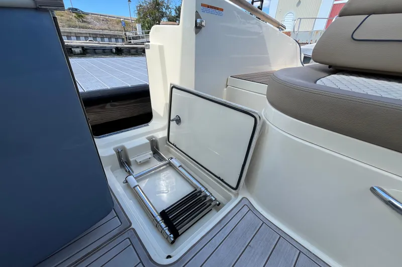  Yacht Photos Pics 2022 Chris-Craft Launch 35 GT I/O boat with integrated swim ladder storage.