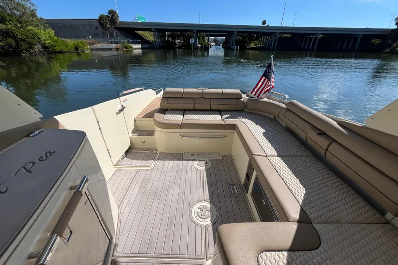  Yacht Photos Pics 2022 Chris-Craft Launch 35 GT I/O boat interior with seating and American flag.
