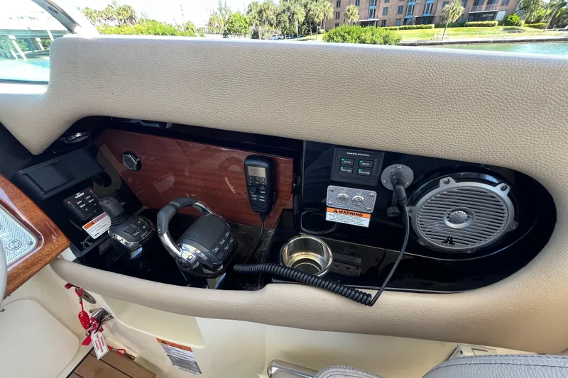  Yacht Photos Pics 2022 Chris-Craft Launch 35 GT I/O dashboard with controls, speaker, and communication devices.