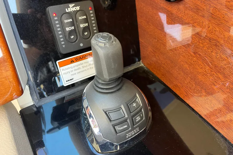  Yacht Photos Pics Control panel of 2022 Chris-Craft Launch 35 GT I/O with joystick and Lenco trim tab.