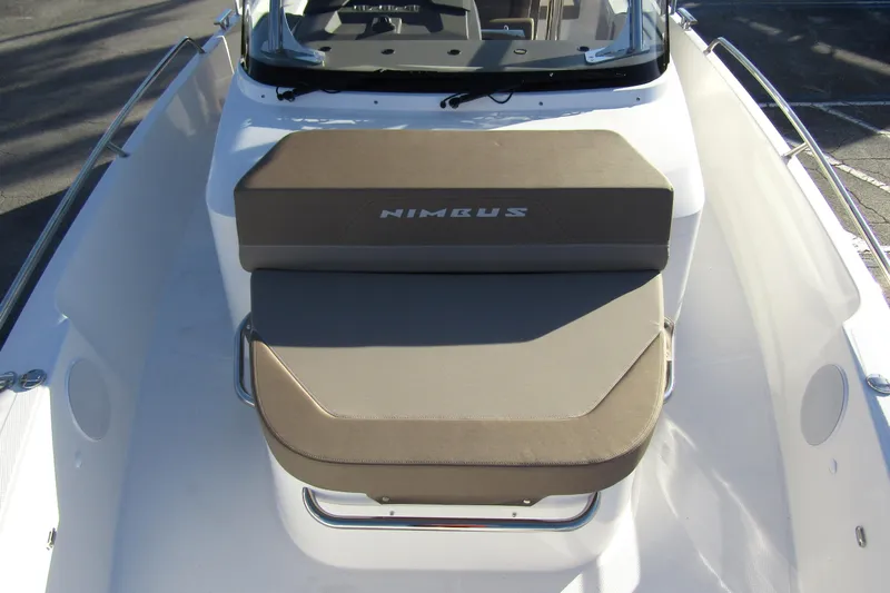  Yacht Photos Pics 2025 Nimbus Tender 9 boat with cushioned seating and sleek design.