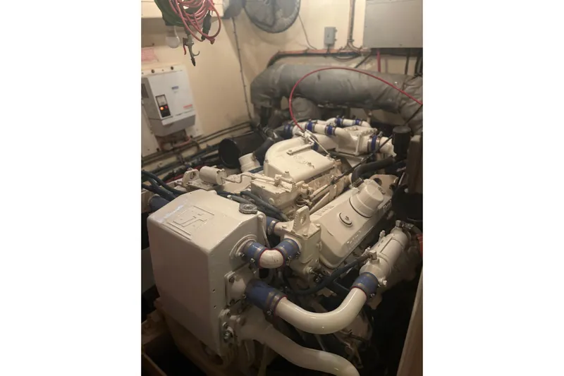 Ruby Yacht Photos Pics Engine room of a 1981 Hatteras 56 Motor Yacht, showcasing mechanical components.
