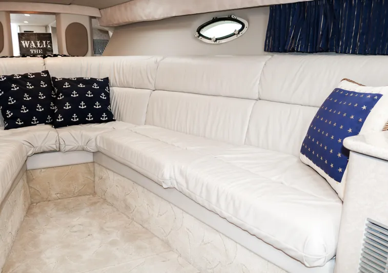  Yacht Photos Pics Interior of 2003 Formula 370 Super Sport with white leather seating and nautical-themed pillows.