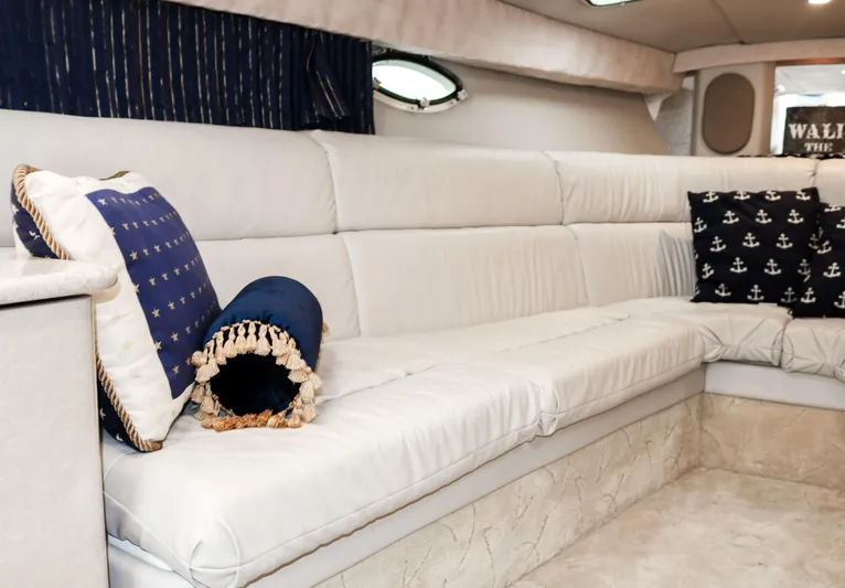  Yacht Photos Pics Interior of 2003 Formula 370 Super Sport boat with white leather seating and nautical-themed pillows.