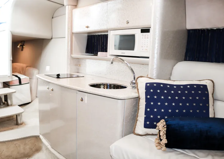  Yacht Photos Pics 2003 Formula 370 Super Sport interior with kitchenette and seating area.