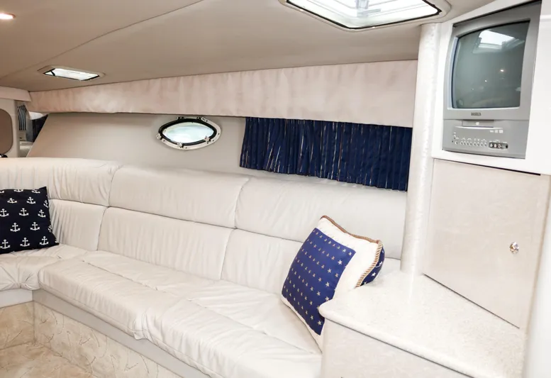 Yacht Photos Pics Interior of 2003 Formula 370 Super Sport with white leather seating and built-in TV.