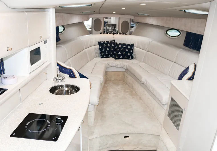  Yacht Photos Pics Luxurious interior of a 2003 Formula 370 Super Sport yacht with white leather seating.